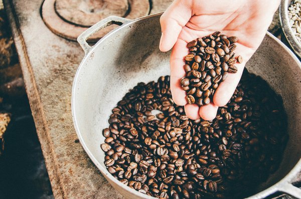 What are the key considerations for installing a commercial-grade coffee roaster in a cafe?